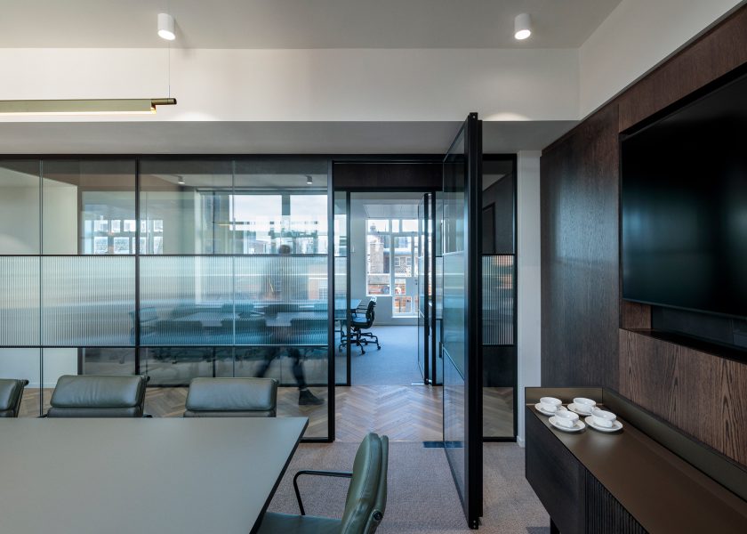 See through glass partitions in an office space.