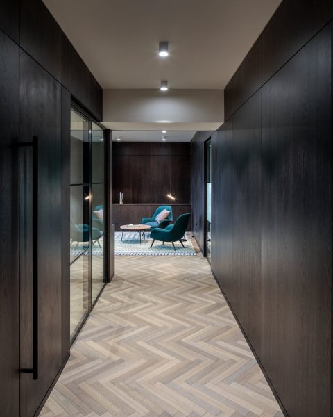Herringbone parquet floor tiles in an office, in London.