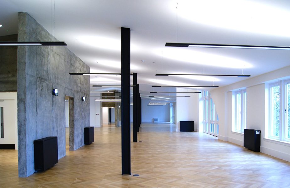 Exposed black steel beams create an industrial look in this office space in London.