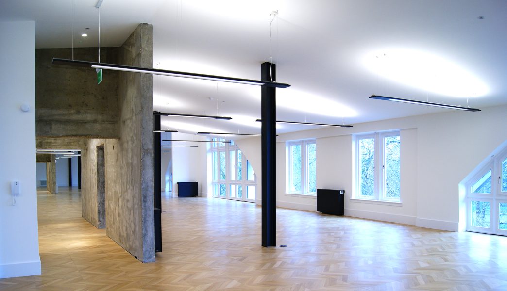 Parquet style flooring throughout in a office space.