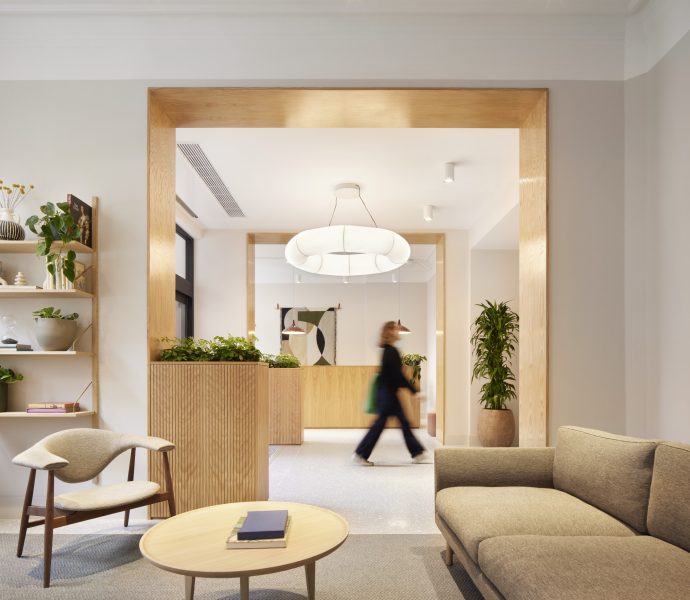 Office spaces at Temple Chambers, reception space with a woman walking by.